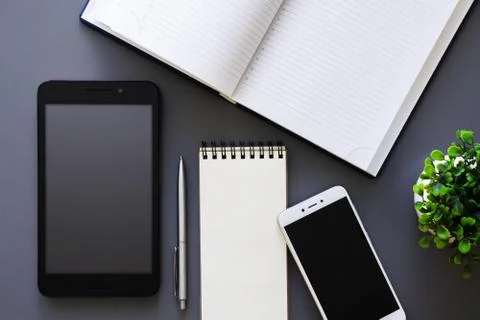 Office working table top view with planner and gadgets Stock Photos