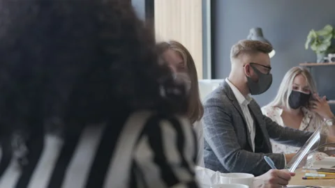 Office workplace with coronavirus safety measures. Young multiethnic business Stock Footage 137203053
