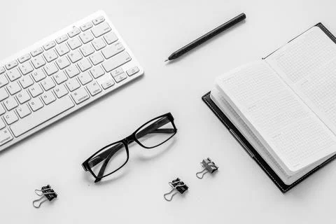 Office workplace flat lay with keyboard wand notebook Stock Photos