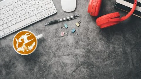 Office workplace with keyboard computer, mouse, notebook, headphone, pen an.. 写真素材