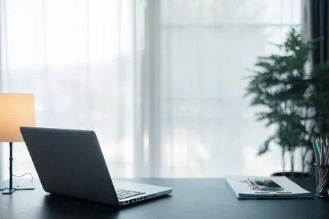 Office workplace with laptop and smart phone on wood table. Workspace, desk.. Stock Photos