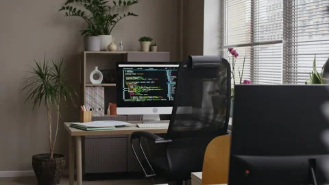 Office Workspace with Coding Screen on Computer Monitor Stock Footage 321814696
