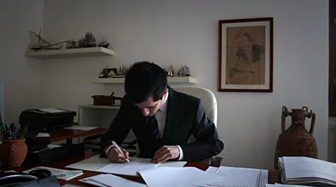 Office:Manager analyzes documents Stock Footage 54838059