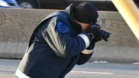 Officer with camera taking picures Stock Footage 125310886