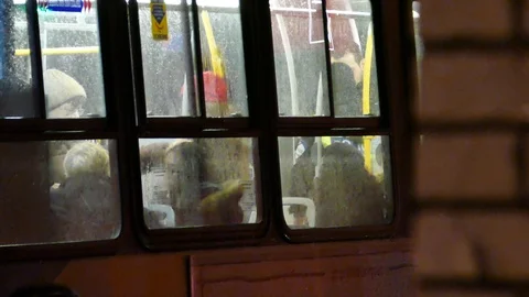 Officer inside city bus with passengers Stock Footage 105344272