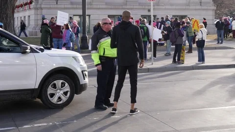 Officer Talking to Protester  Stock Footage 85071639