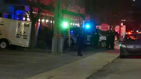 Officer taping scene at night Stock Footage 139664226