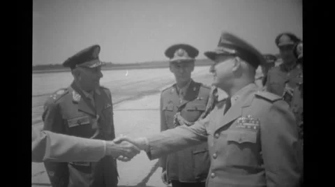 Officers saluting and shaking hands at airport Stock Footage