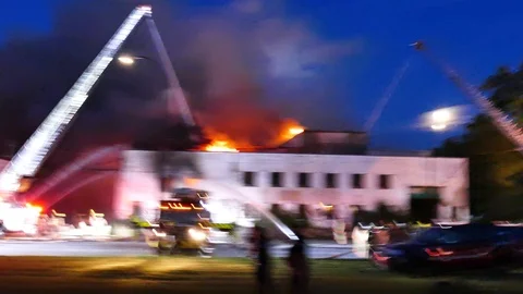 Officers at structure fire scene Stock Footage 115976104