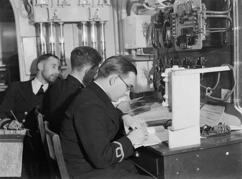 Officers at work in the decoding office of HMS SHEFFIELD during an Arctic ... Stock Photos