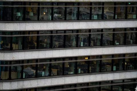 Offices through windows in a cooperate building. Stock Photos