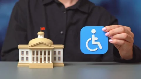 An official explains disability status. Government programs ensure access, Stock Footage 342258883