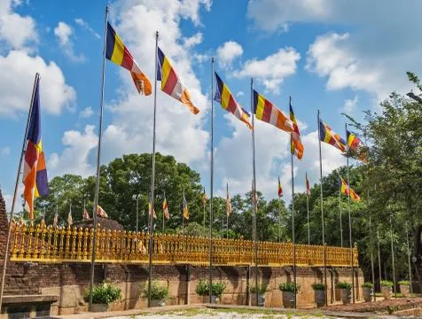 Official flags of the Buddhism flutter on wind Stock Photos