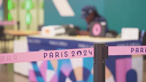 Official Working On Desk During the Paris 2024 Olympic Summer Games Stock Footage 282182677