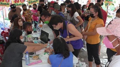 Officials assisting voters outside polling stations during Philippine elections. Stock-Footage 192547855