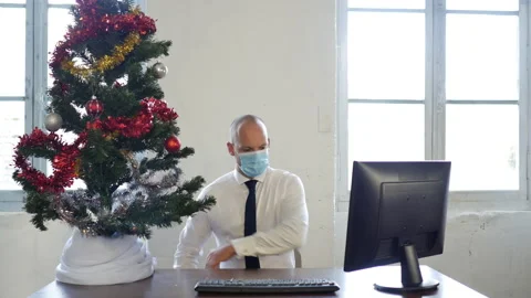 Offie worker looking at Christmas tree during working business hour. creative Stock Footage 143298696