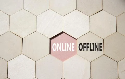 Offline or Online symbol. Concept word Offline or Online on wooden comb puz.. Stock Photos