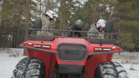 Offroad ATV group getting ready in wintry forest scene. Team of ATV riders Stock Footage 346203063