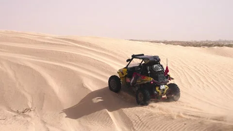 Offroad Buggy Drifting Across Sand Dune With Exploding Dust Trail In Open Desert Stock Footage 327892623