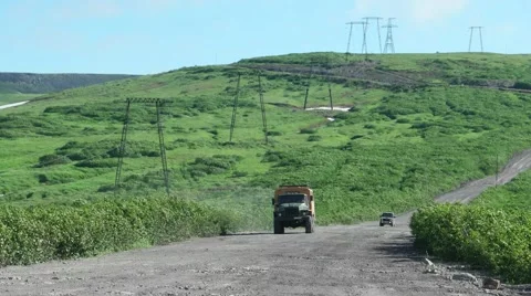 Offroad bus goes along power line, Kamchatka Stock Footage 66190639
