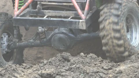 Offroad car in the mud spins the wheel Stock Footage 157692566