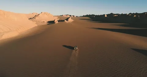 Offroad Car Passing From Sand Dunes In the lut desert - Iran Stock Footage 246985073