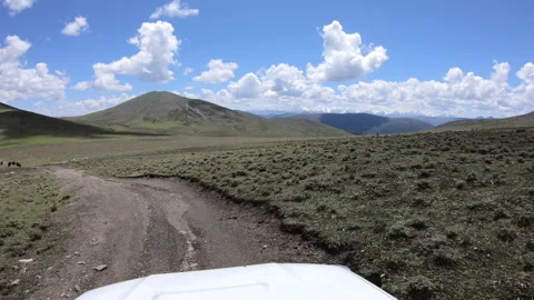 Offroad car running on the summer high altitude mountain trail, China Stock Footage 299472240