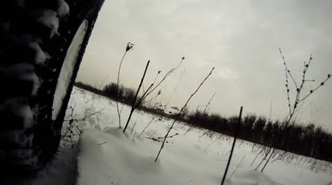 Offroad driving through snowy lowland Stock Footage 14808402