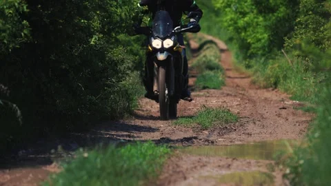 Offroad Motorcycle Rider Navigating Muddy Dirt Trail Video stock 344147805