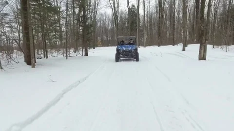 Offroad utv amazing camera angle down trail winter 4k gimbal Stock Footage 72002469