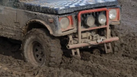 Offroad vehicle in the muddy area Stock Footage 71306161