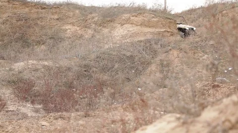 Offroad vehicle quick driveby with explosion Video stock 78010148