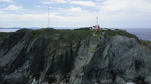 An offshore aerial approch of the Long Point Lighthouse Stock Footage 228687797