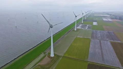 Offshore and onshore wind turbines generating renewable energy Stock Footage 329647319