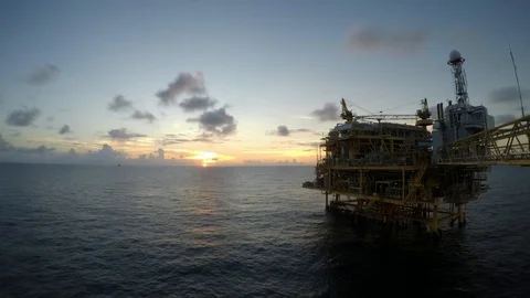 Offshore Central processing platform sunset time lapse day to night Stock Footage 85697009