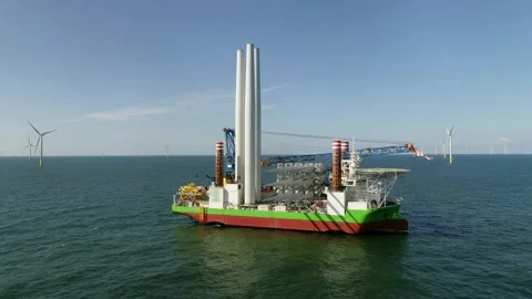 Offshore construction ship near a windfarm Stock Footage 289964703