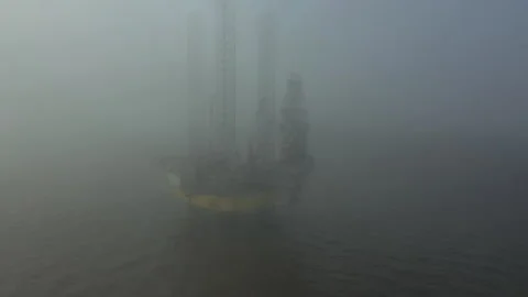 Offshore drilling platform in fog. Self-lifting Floating RIG with raised legs Stock Footage 263717463