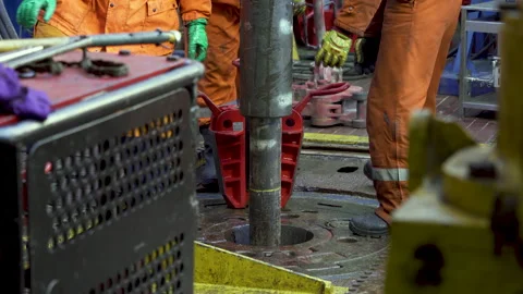 Offshore drilling platform. Rotor table. Manual slips removed. Drilling pipe Stock Footage 251564030