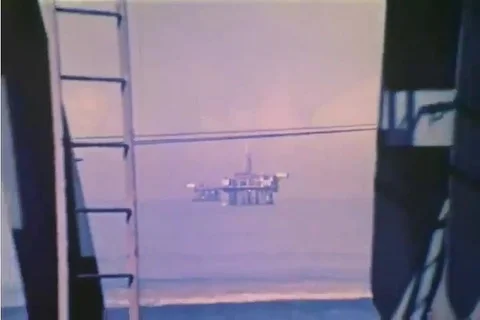 An offshore drilling project is set up and shown in the 1970s Stock Footage 90624192