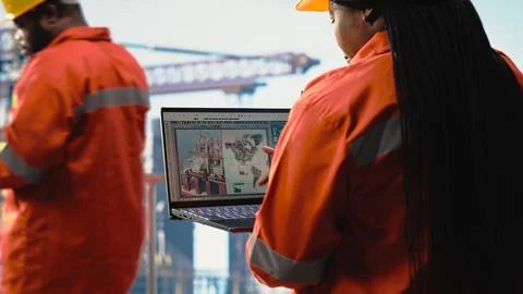Offshore engineer using laptop to analyze subsea mapping data Stock Photos