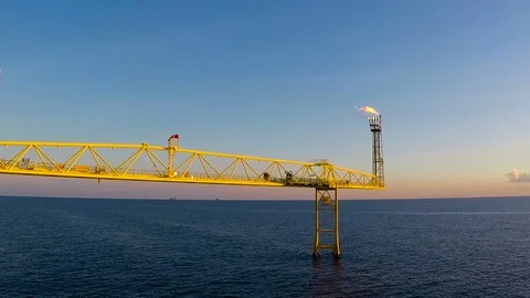 Offshore flare during normal operation Stock Footage 87499799