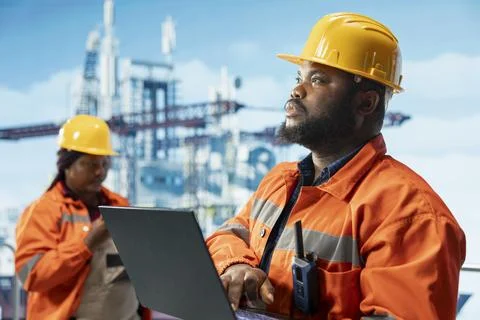 Offshore installation manager and engineer monitoring operations 写真素材