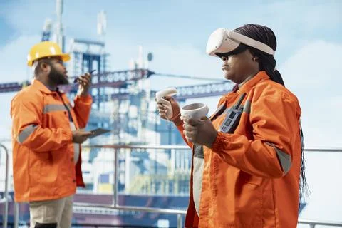 Offshore installation worker managing maintenance systems with VR goggles Stock Photos