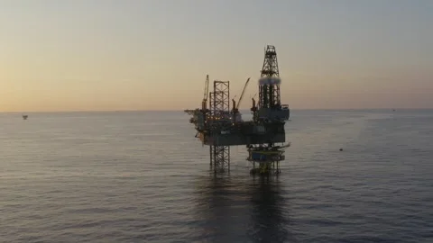 Offshore jack up drilling rig during sunset Video stock 272232139