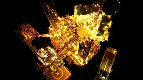 Offshore jack-up drilling rig at night Stock Footage 119624245