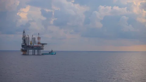 Offshore jack up drilling rig at the offshore location with flare bridge of prod Stock Footage 146335812