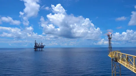 Offshore jack up drilling rig at the offshore location with flare bridge of prod Stock Footage 153911083