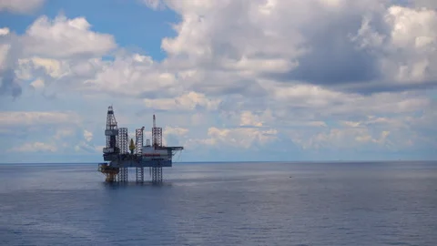 Offshore jack up drilling rig at the offshore location with flare bridge of prod Stock Footage 155221655