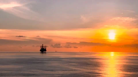 Offshore jack up drilling rig at the offshore location with flare bridge of prod Stock Footage 211112145