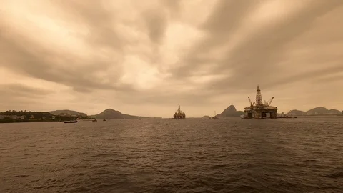 Offshore oil platform and the Sugar Loaf seen from the barge. Stock Footage 126255880